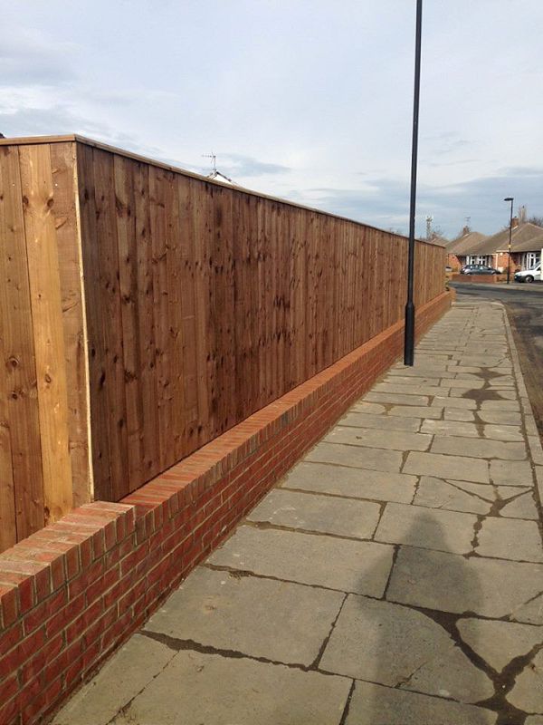 Fence on top of wall